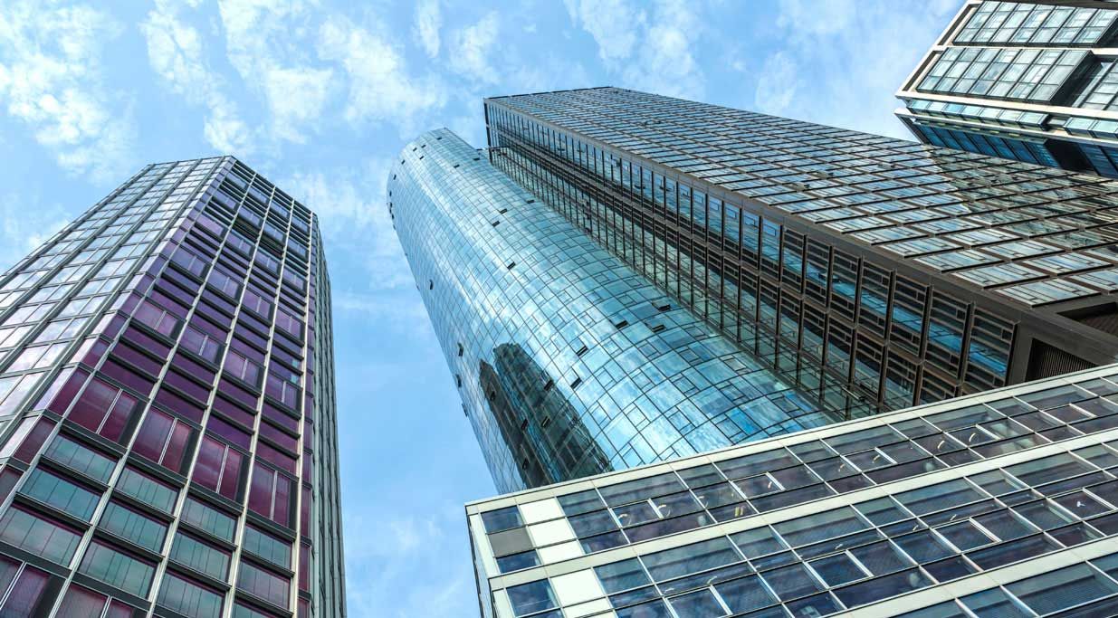 A low-angle camera shot of an office tower in Frankfurt, Germany.