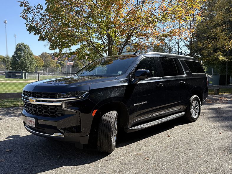 A Chevrolet Suburban luxury SUV, used by Commonwealth Worldwide for chauffeured black car services.